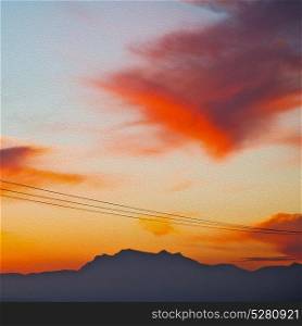 mountain in morocco africa and red sunrise current cables power pylon