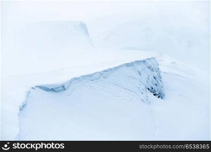 Mountain in snow with fog. Mountain in blue snow with fog. Winter landscape