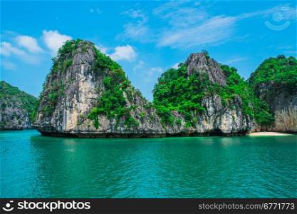 Mountain island and lonely beach in Halong Bay, Vietnam, Southeast Asia