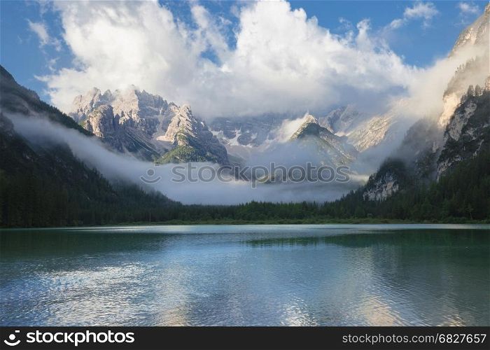 Mountain lake at misty morning. Lago di Landro, Dolomites Alps, Italy