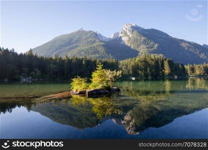 Mountain lake at sunny morning