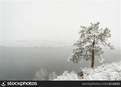 mountain lake in a heavy April snowstorm - Horsetooth Reservoir in Fort Collins, Colorado