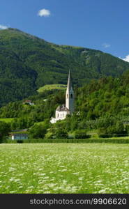 Mountain landscape along the road from Glorenza to Prato allo Stelvio, Bolzano province, Trentino Alto Adige, Italy, in the summertime. Church