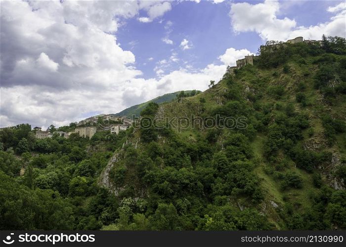 Mountain landscape along the road of Gole del Sagittario, famous canyon in Abruzzo, Italy, L Aquila province. View of Villalago, old village