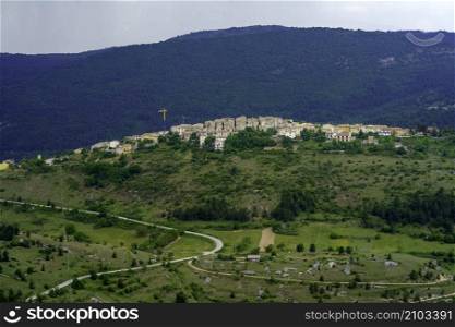 Mountain landscape at Gran Sasso Natural Park, in Abruzzo, Italy, L Aquila province, at springtime (June). View of Castelvecchio Calvisio, historic village