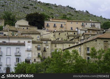 Mountain landscape at Gran Sasso Natural Park, in Abruzzo, Italy, L Aquila province, at springtime (June). View of Calascio, historic village