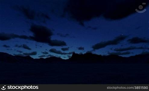 Mountain landscape at night, timelapse clouds