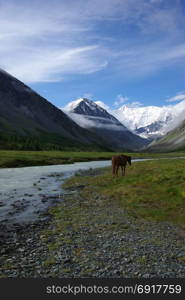 Mountain landscape. Highlands, the mountain peaks, gorges and valleys. The stones on the slopes. Mountain landscape. Highlands, the mountain peaks, gorges and valleys. The stones on the slopes.