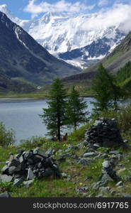 Mountain landscape. Highlands, the mountain peaks, gorges and valleys. The stones on the slopes. Mountain landscape. Highlands, the mountain peaks, gorges and valleys. The stones on the slopes.