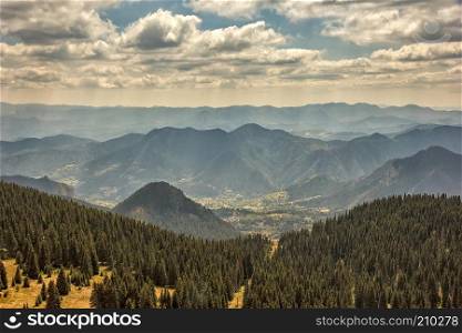 Mountain landscape. Panoramic view from top to a mountain and valley between hills 