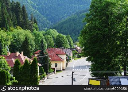 mountain landscape. road through small mountain village