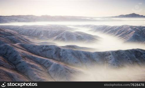 mountain landscape with deep fog at morning