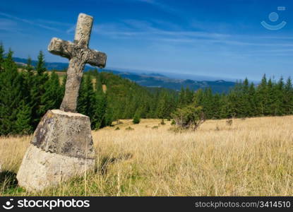 mountain landscape with old cross. nature