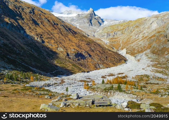 Mountain landscape with snowy peak in sunshine, Alps, Italy