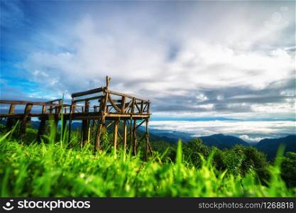 Mountain natural balcony in Doi Ang Khang, Thailand. Green grass and beautiful sky.