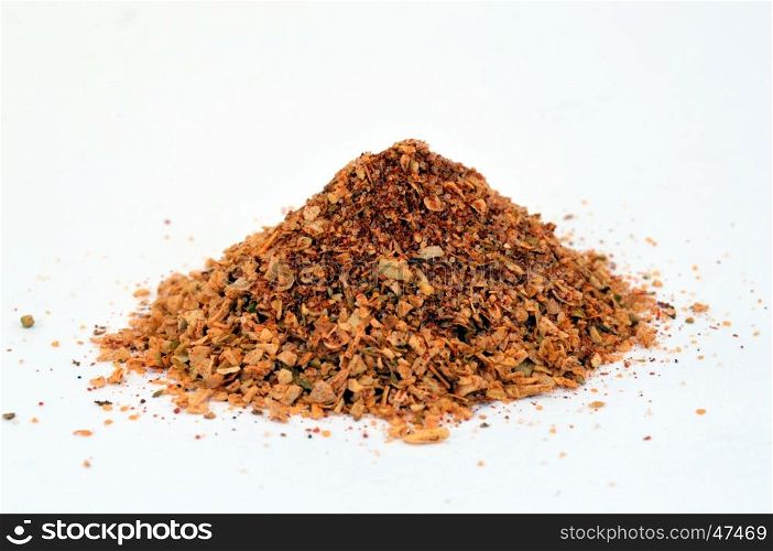 Mountain of spices with spaghetti. On a white bottom.