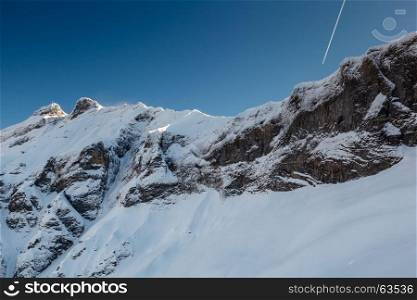 Mountain Peak and Airplane Trail near Megeve in French Alps, France