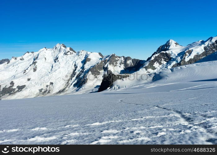 Mountain peak. Mountain landscape with snow and clear blue sky