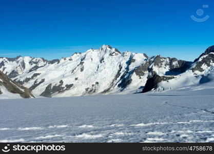 Mountain peak. Mountain landscape with snow and clear blue sky