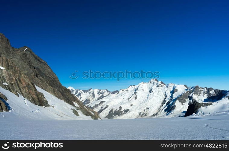 Mountain peak. Mountain landscape with snow and clear blue sky