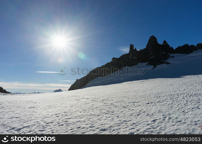 Mountain peak. Mountain landscape with snow and clear blue sky