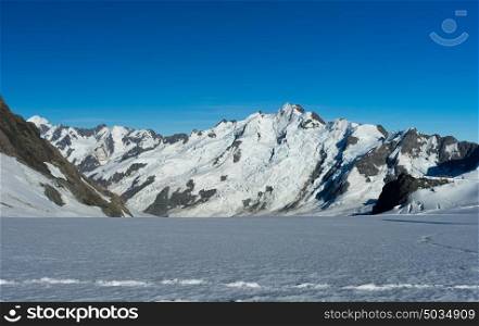 Mountain peak. Mountain landscape with snow and clear blue sky