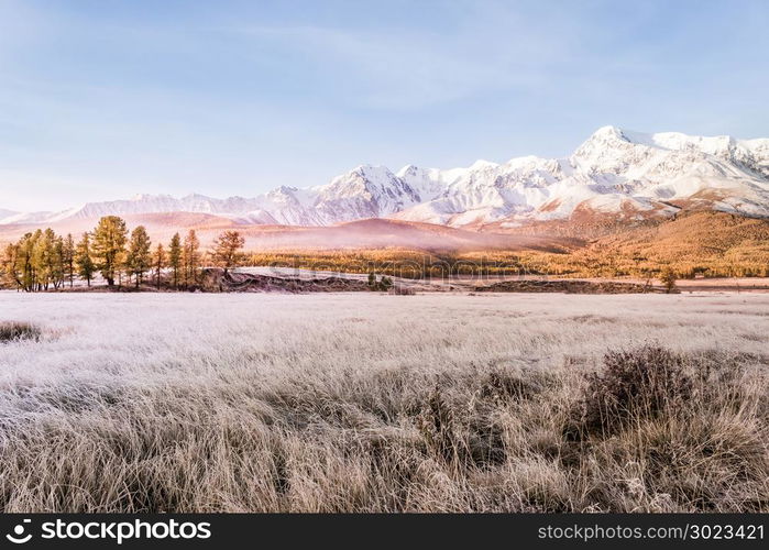 Mountain peak, snowy peak Sunny day. Landscape on the mountain range in pastel colors, autumn weather.