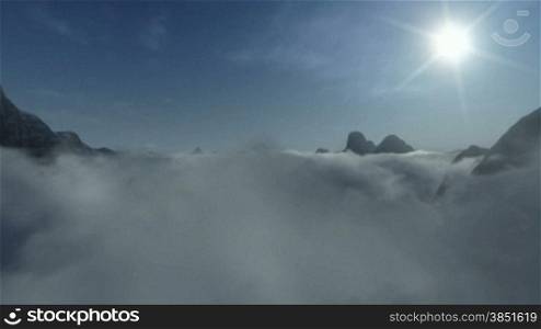 Mountain Peaks above Time Lapse Clouds