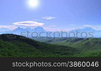 Mountain peaks covered with snow. Green hills and valleys. White mist in the distance. Day. Blue sky, white clouds float. Through the haze of the sun shines brightly. The camera quickly flies over the mountains and soars skyward.