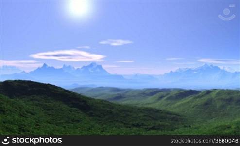 Mountain peaks covered with snow. Green hills and valleys. White mist in the distance. Day. Blue sky, white clouds float. Through the haze of the sun shines brightly. The camera quickly flies over the mountains and soars skyward.