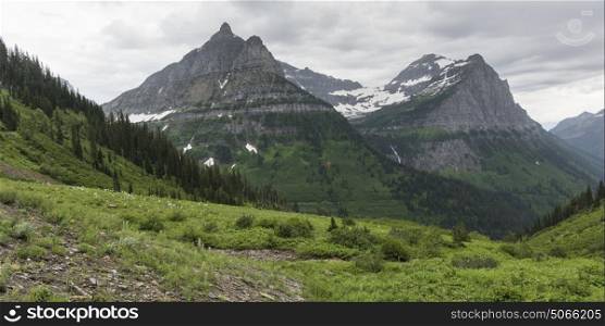 Mountain range against cloudy sky, West Glacier, Going-to-the-Sun Road, Glacier National Park, Glacier County, Montana, USA