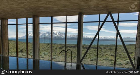 Mountain range viewed through a window of the Tierra Patagonia Hotel, Torres Del Paine National Park, Patagonia, Chile