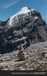 Mountain Ridge in Italian Dolomites Alps in Summer Time and Stones Stacked One Onto Each Other