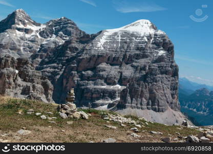 Mountain Ridge in Italian Dolomites Alps in Summer Time and Stones Stacked One Onto Each Other