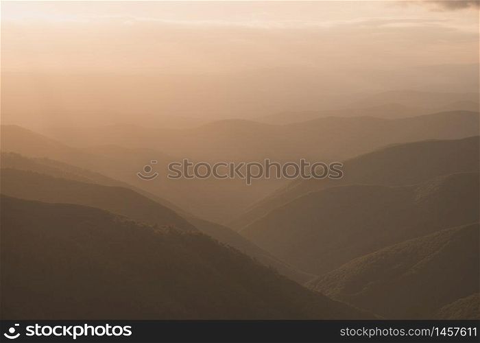 Mountain ridge silhouette panoramic landscape. Nature landscape view of beautiful sunset over mountains and valley