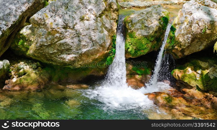 Mountain river. A stream of water in forest and mountain terrain. Crimea, the Grand Canyon.