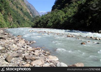 Mountain river and mount near Manaslu in Nepal