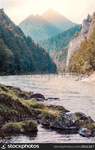 Mountain river valley landscape. Beautiful natural scenery before sunset. Dunajec river at the foot of Trzy Korony (Three Crowns) peak in the Pieniny Mountains