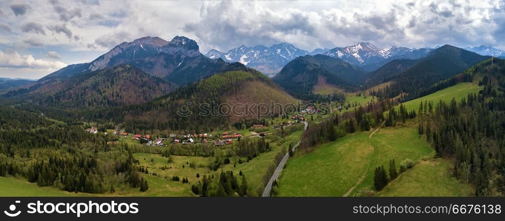 Mountain road between Poland and Slovakia. High Tatras mountains with snow-caped spring peaks panorama. Mountain road between Poland and Slovakia. High Tatras