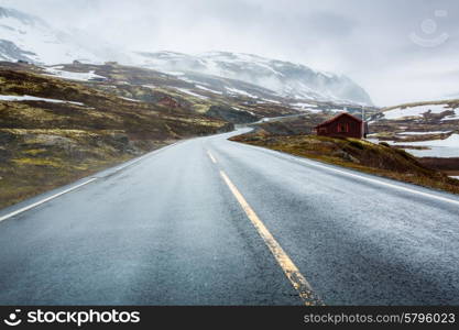 Mountain road in Norway, around the fog and snow.