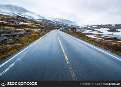 Mountain road in Norway.. Mountain road in Norway, around the fog and snow.