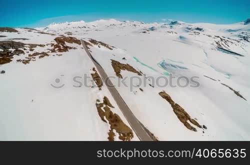 Mountain road in Norway with high snow wall