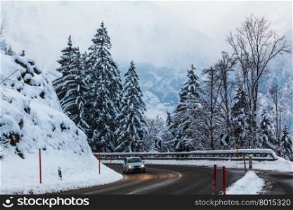 Mountain road in winter. Winter landscape. Winter road and trees covered with snow