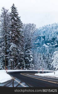 Mountain road in winter. Winter landscape. Winter road and trees covered with snow