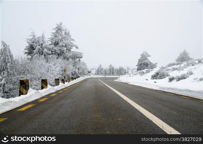 Mountain road with white snow.