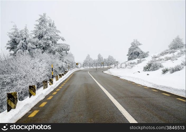 Mountain road with white snow.