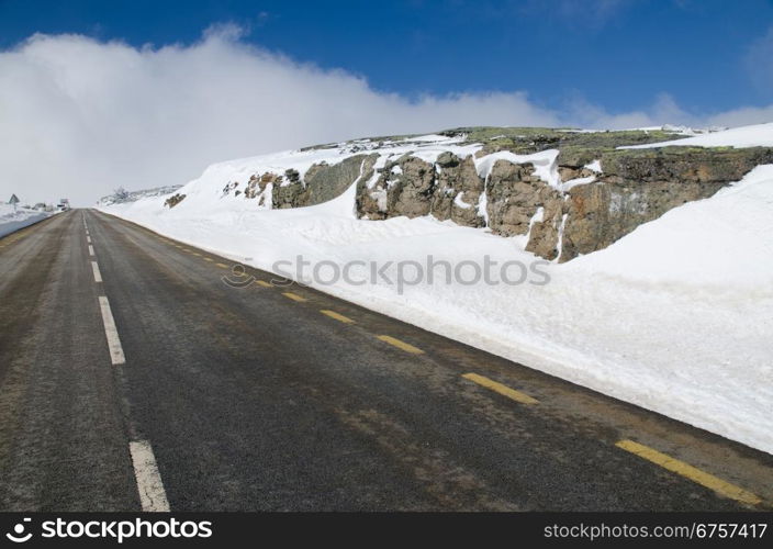 Mountain road with white snow.