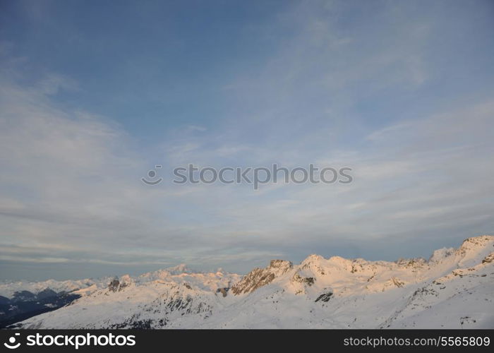 mountain snow fresh sunset at ski resort in france val thorens