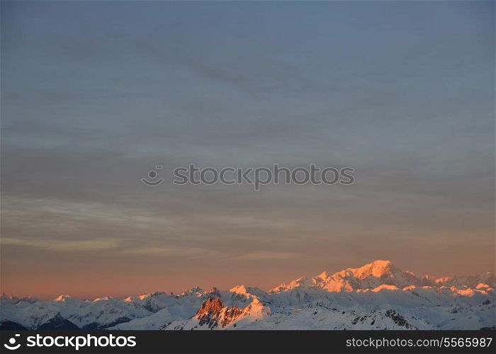 mountain snow fresh sunset at ski resort in france val thorens