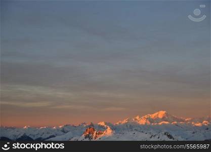 mountain snow fresh sunset at ski resort in france val thorens